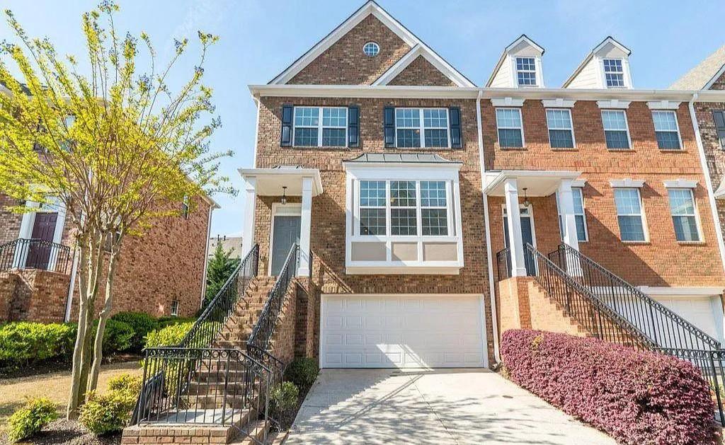 6120 Joybrook Road Duluth, GA 30097 - Photo 1 of 30 a front view of a house with a yard