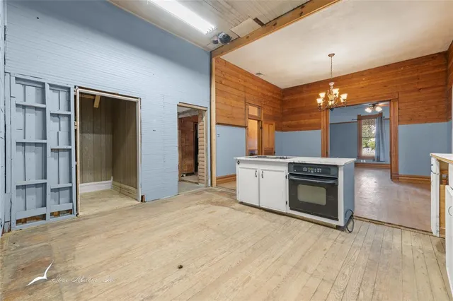 a view of a kitchen with furniture and a fireplace
