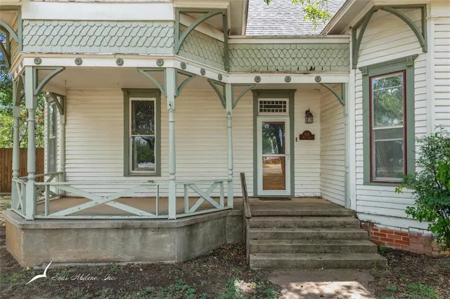 front view of a house with a large window