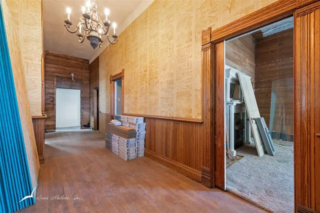 a view of a livingroom with furniture and stairs