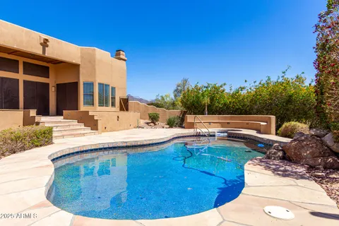 a view of a swimming pool with a patio