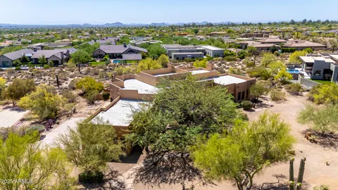 an aerial view of a house with patio
