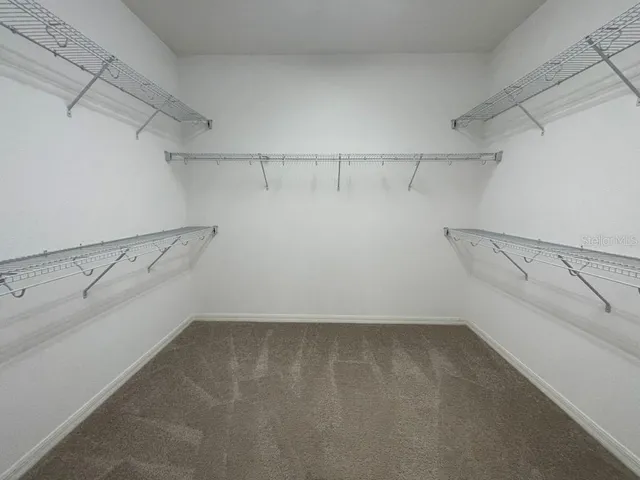 a view of a room with racks on the wall