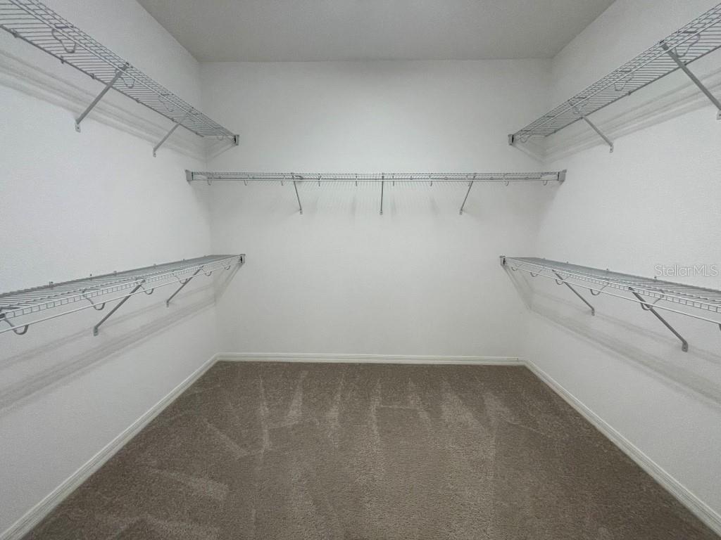 191 Sun Palm Lane Altamonte Springs, FL 32701 - Photo 13 of 16 a view of a room with racks on the wall