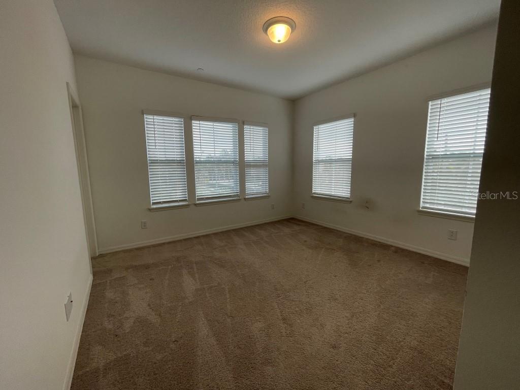 191 Sun Palm Lane Altamonte Springs, FL 32701 - Photo 14 of 16 an empty room with windows