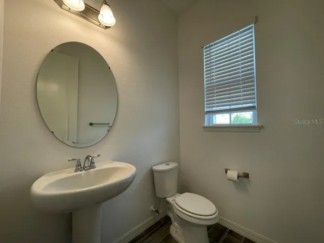 a bathroom with a sink and a toilet