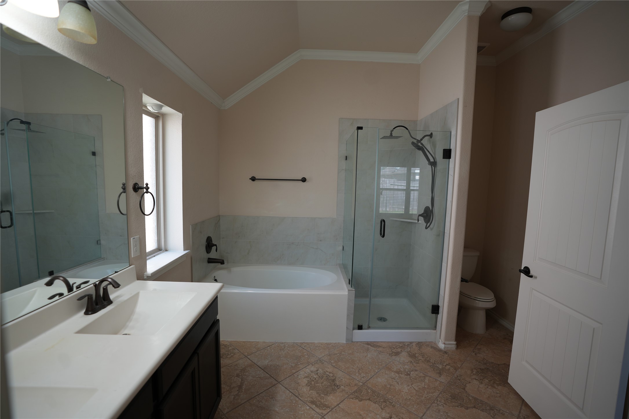 1710 Thornhampton Court Houston, TX 77014 - Photo 15 of 17 a bathroom with a sink a toilet and shower