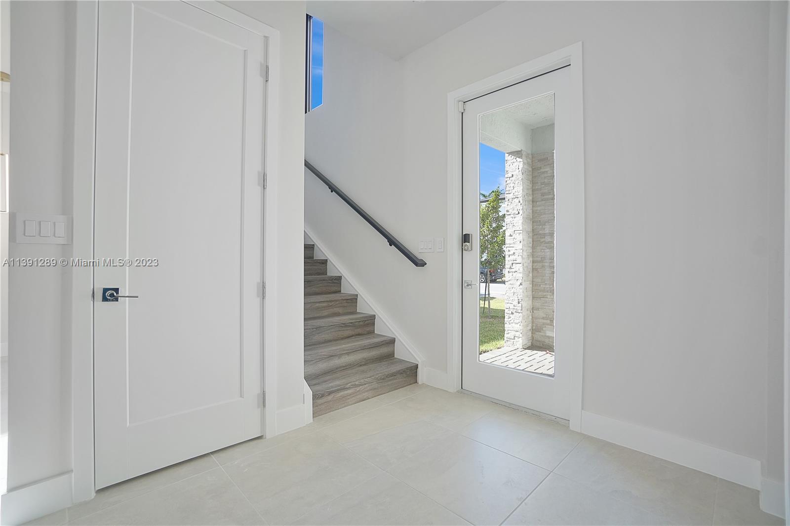 8096 Northwest 48th Terrace Doral, FL 33166 - Photo 16 of 28 a view of an entryway with staircase