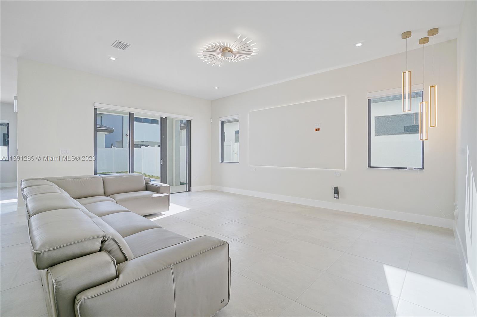 8096 Northwest 48th Terrace Doral, FL 33166 - Photo 17 of 28 a living room with furniture and a window