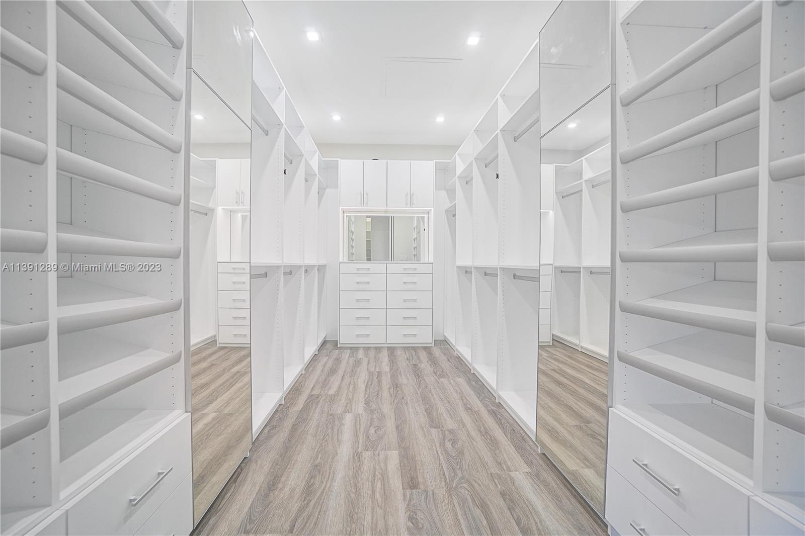 8096 Northwest 48th Terrace Doral, FL 33166 - Photo 2 of 28 a view of walk in closet with empty racks