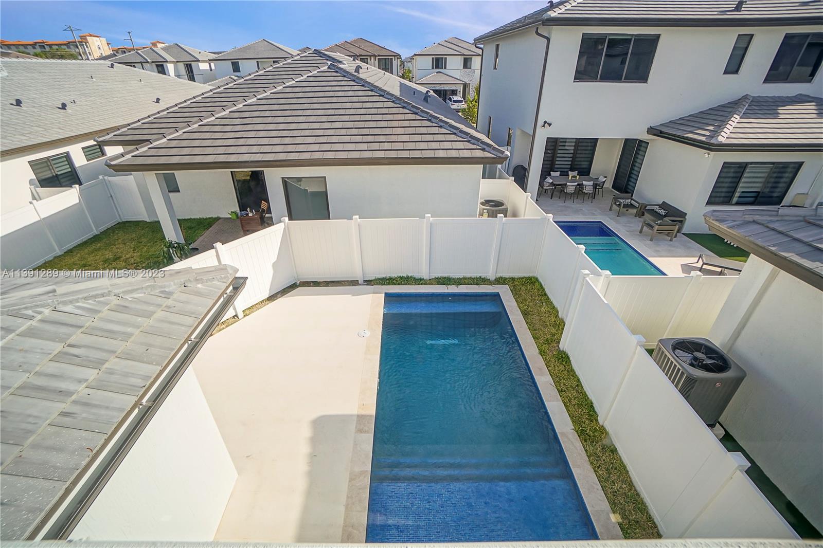8096 Northwest 48th Terrace Doral, FL 33166 - Photo 28 of 28 a view of a house with pool