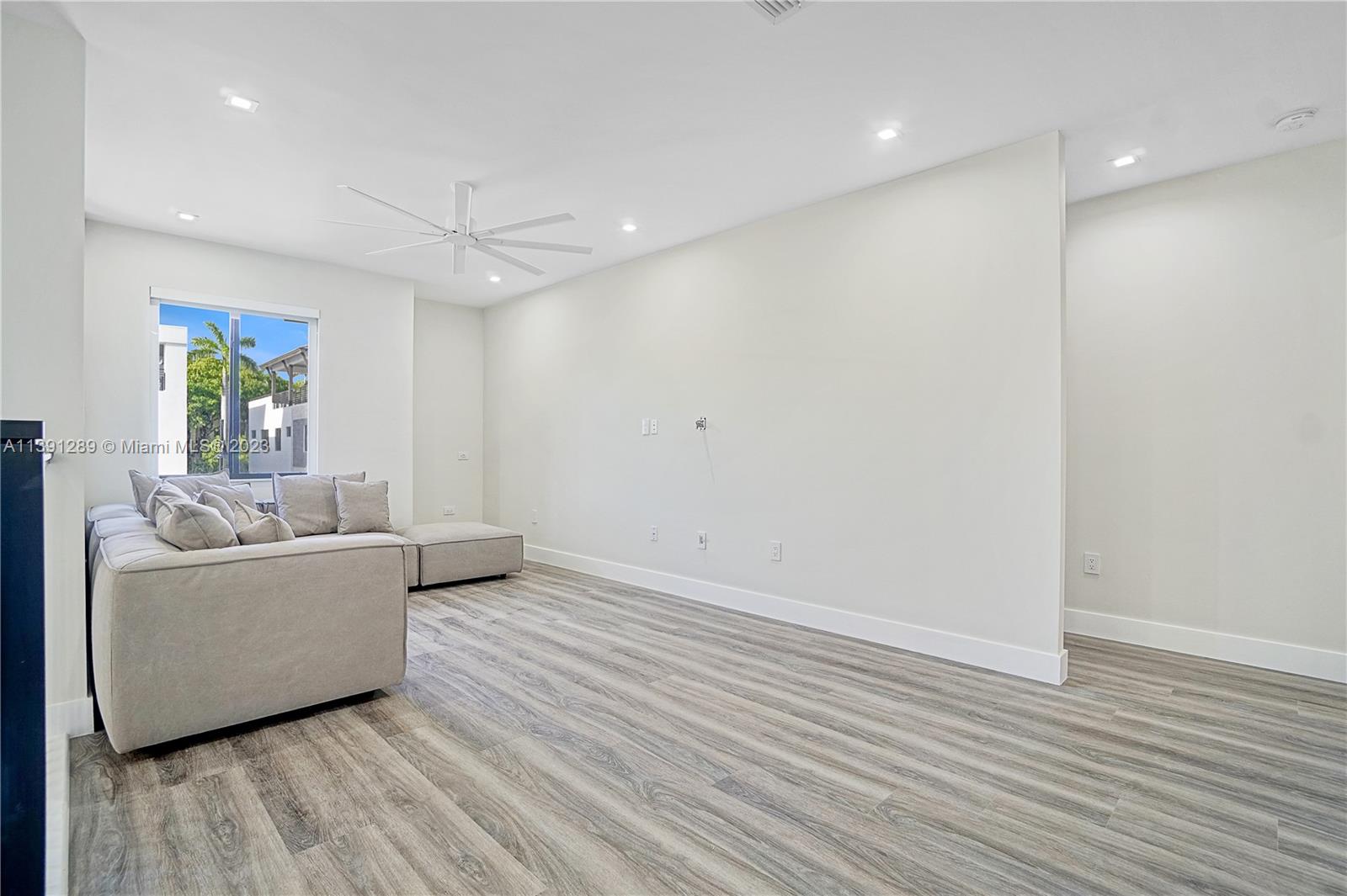 8096 Northwest 48th Terrace Doral, FL 33166 - Photo 8 of 28 a living room with furniture and a wooden floor