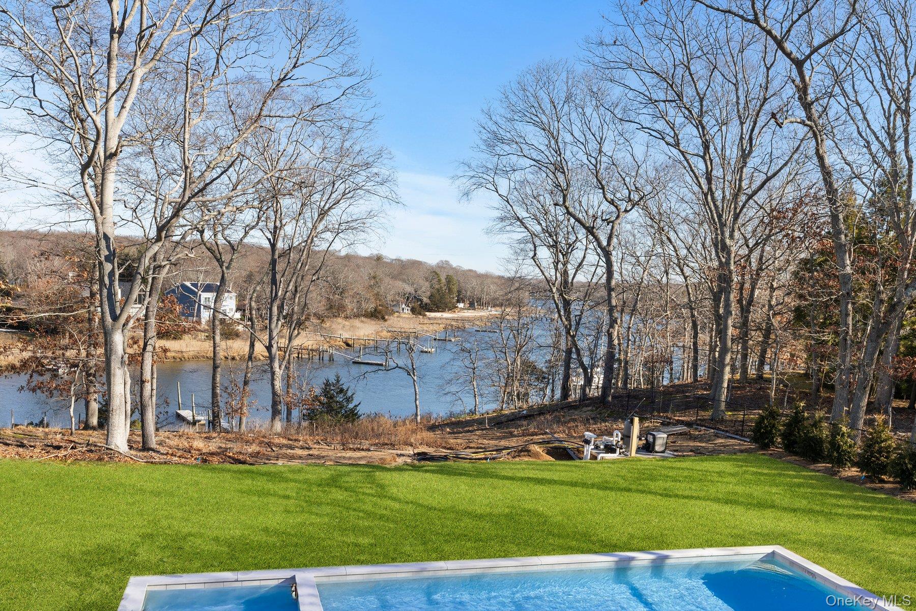 2590 Cox Neck Road Mattituck, NY 11952 - Photo 40 of 50 Gunite pool with expansive yard and water view