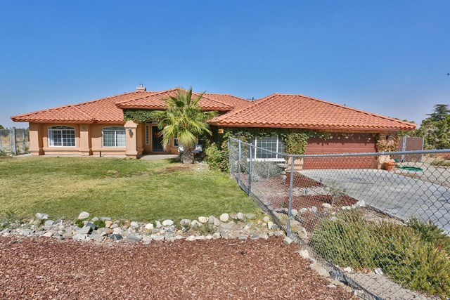 1526 Sage Road Pinon Hills, CA 92372 - Photo 1 of 1 a front view of a house with garden