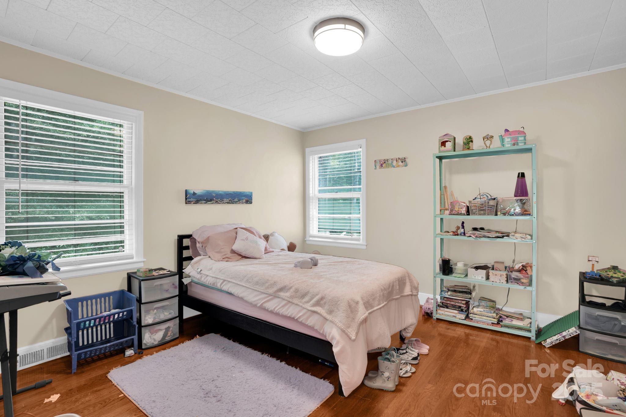 10437 Idlewild Road Matthews, NC 28105 - Photo 11 of 12 a bedroom with a bed and a window