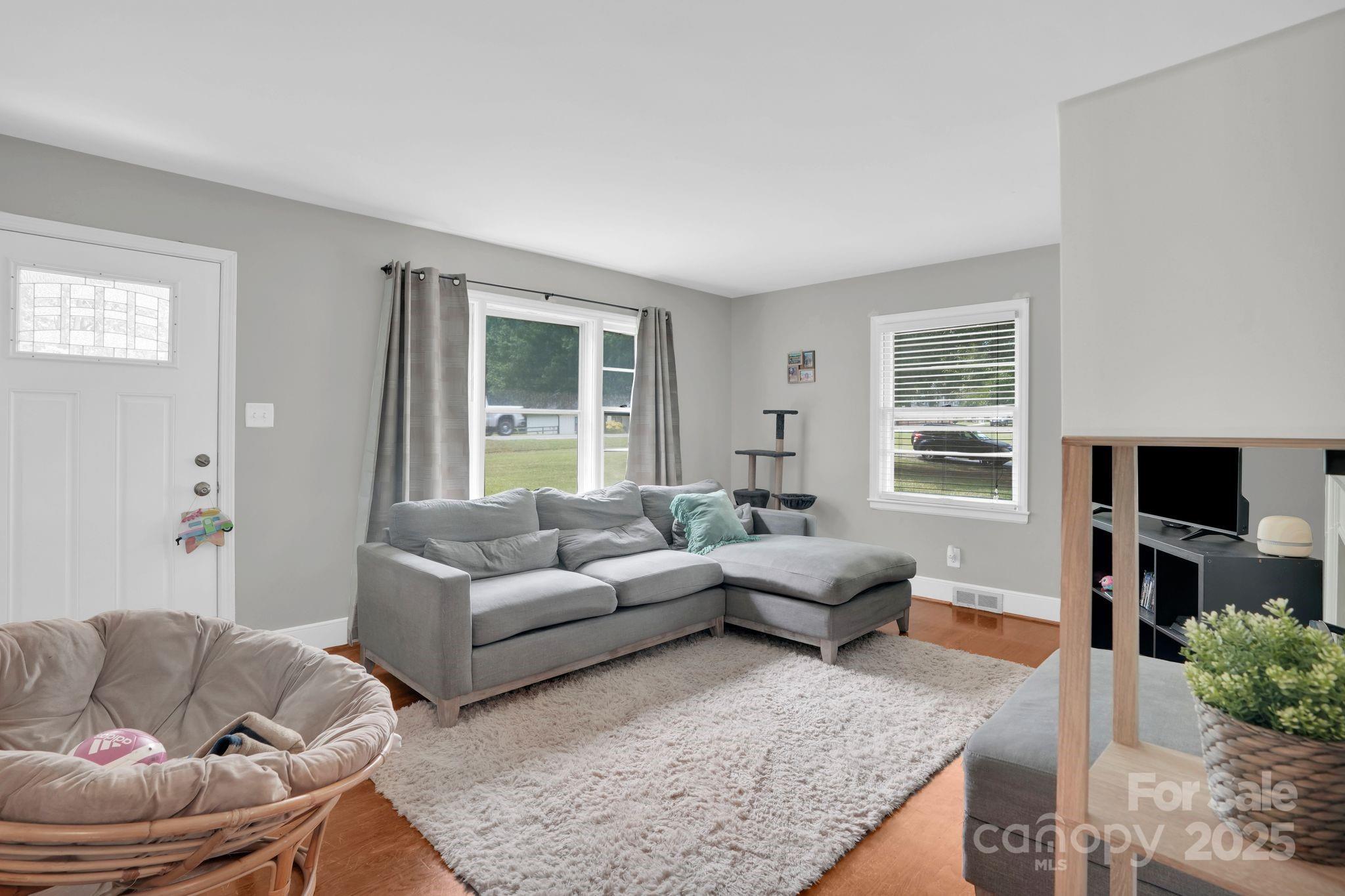10437 Idlewild Road Matthews, NC 28105 - Photo 5 of 12 a living room with furniture and a large window