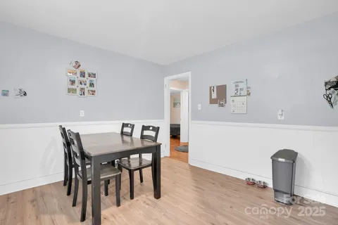 a bedroom with a bed and a television