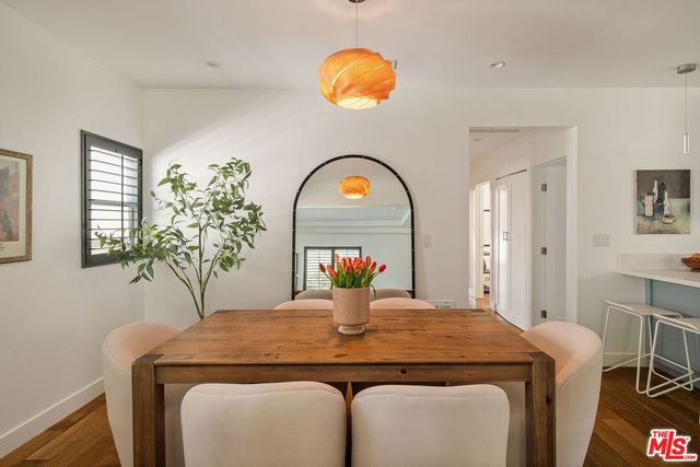 a kitchen with a table and chairs in it