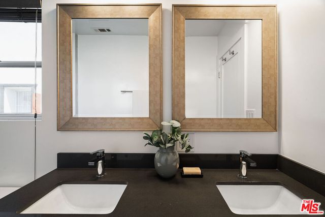 a balcony with table and chairs