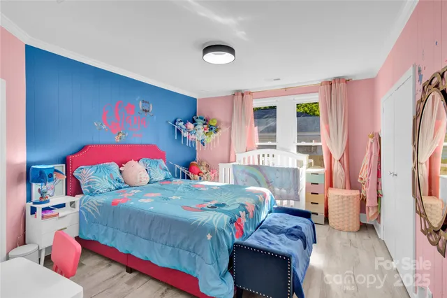 a bedroom with a bed and a couch