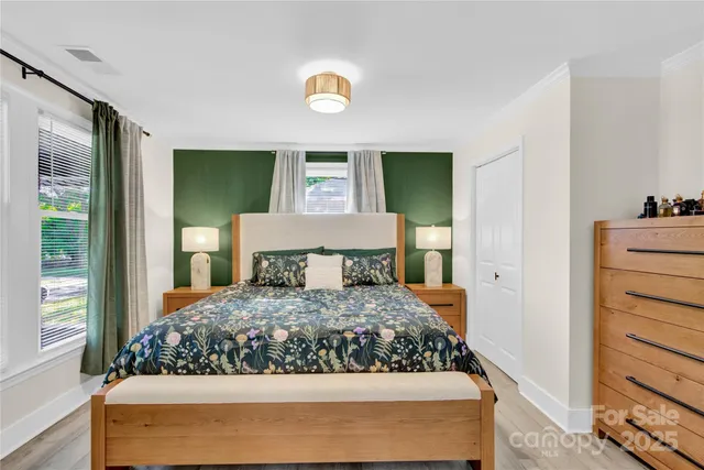 a bedroom with a bed and dresser