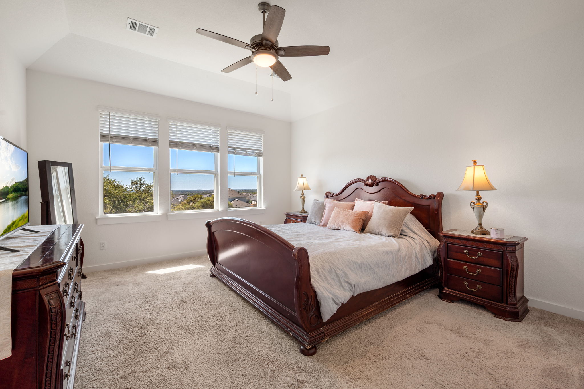 256 Comfort Maple Lane Dripping Springs, TX 78620 - Photo 19 of 39 The owner's suite was strategically positioned for beautiful views.