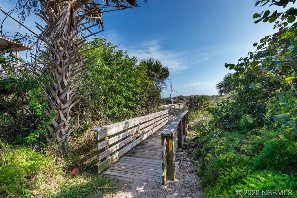 405 Tide Street New Smyrna Beach, FL 32169 - Photo 27 of 33 a view of a wooden bridge