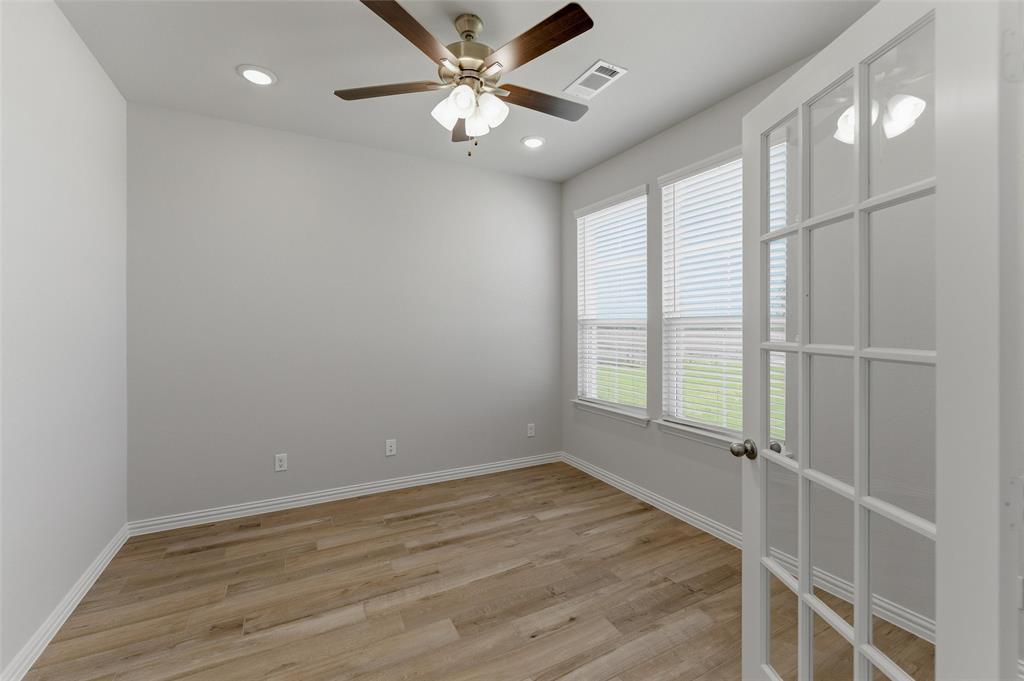2627 Witness Tree Road Terrell, TX 75161 - Photo 6 of 27 wooden floor in an empty room with a window