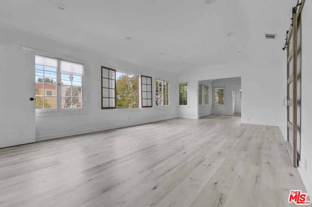 5112 Edgewood Place Los Angeles, CA 90019 - Photo 3 of 21 a view of an empty room with a window