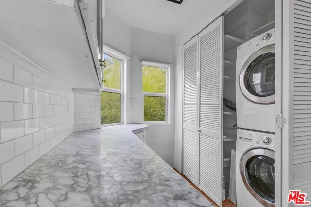 a view of a hallway with washer and dryer