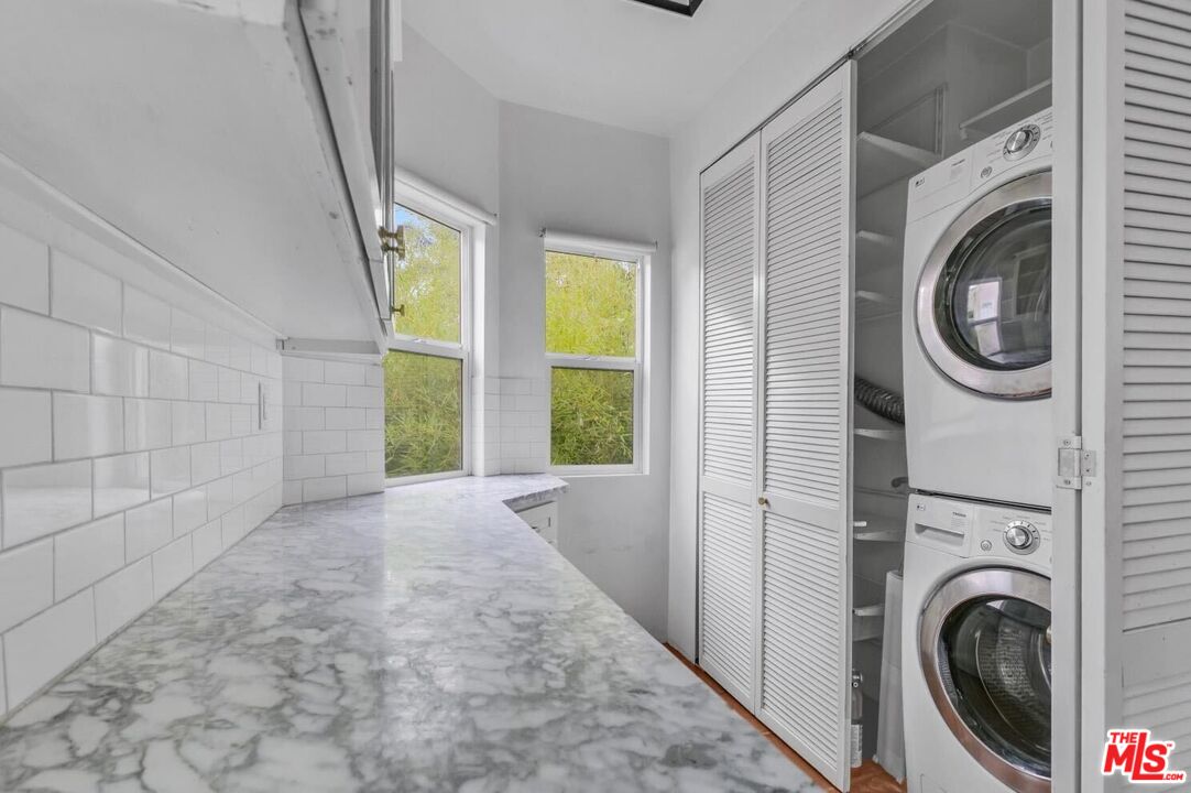 5112 Edgewood Place Los Angeles, CA 90019 - Photo 7 of 21 a view of a hallway with washer and dryer