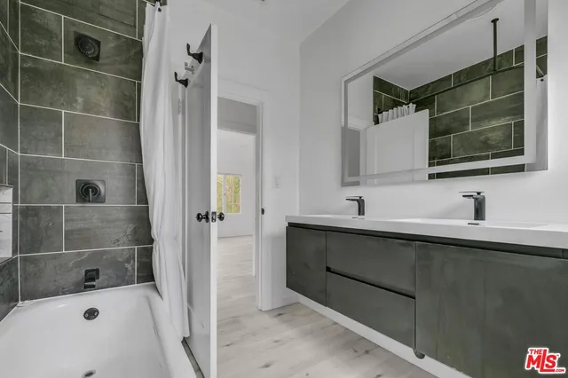 a bathroom with a sink and a mirror