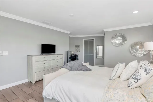 a bedroom with a bed and a closet