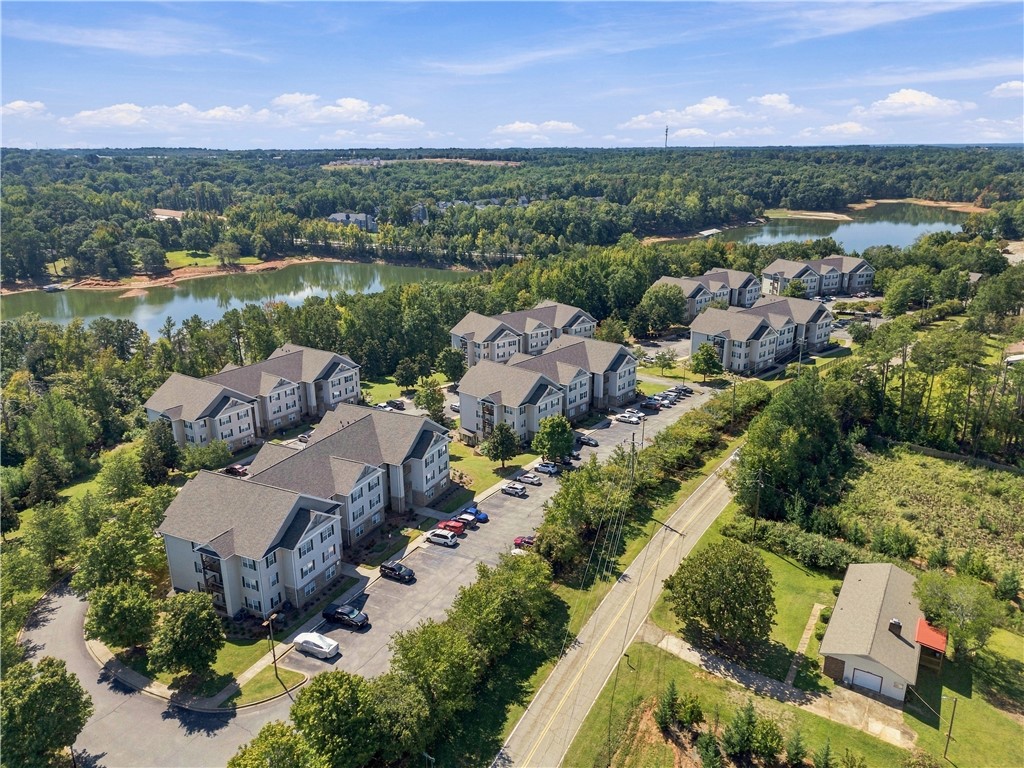 636 Lookover Drive Anderson, SC 29621 - Photo 1 of 34 Multi-family residential buildings sit surrounded by lush woodlands and tranquil lakeside waters.