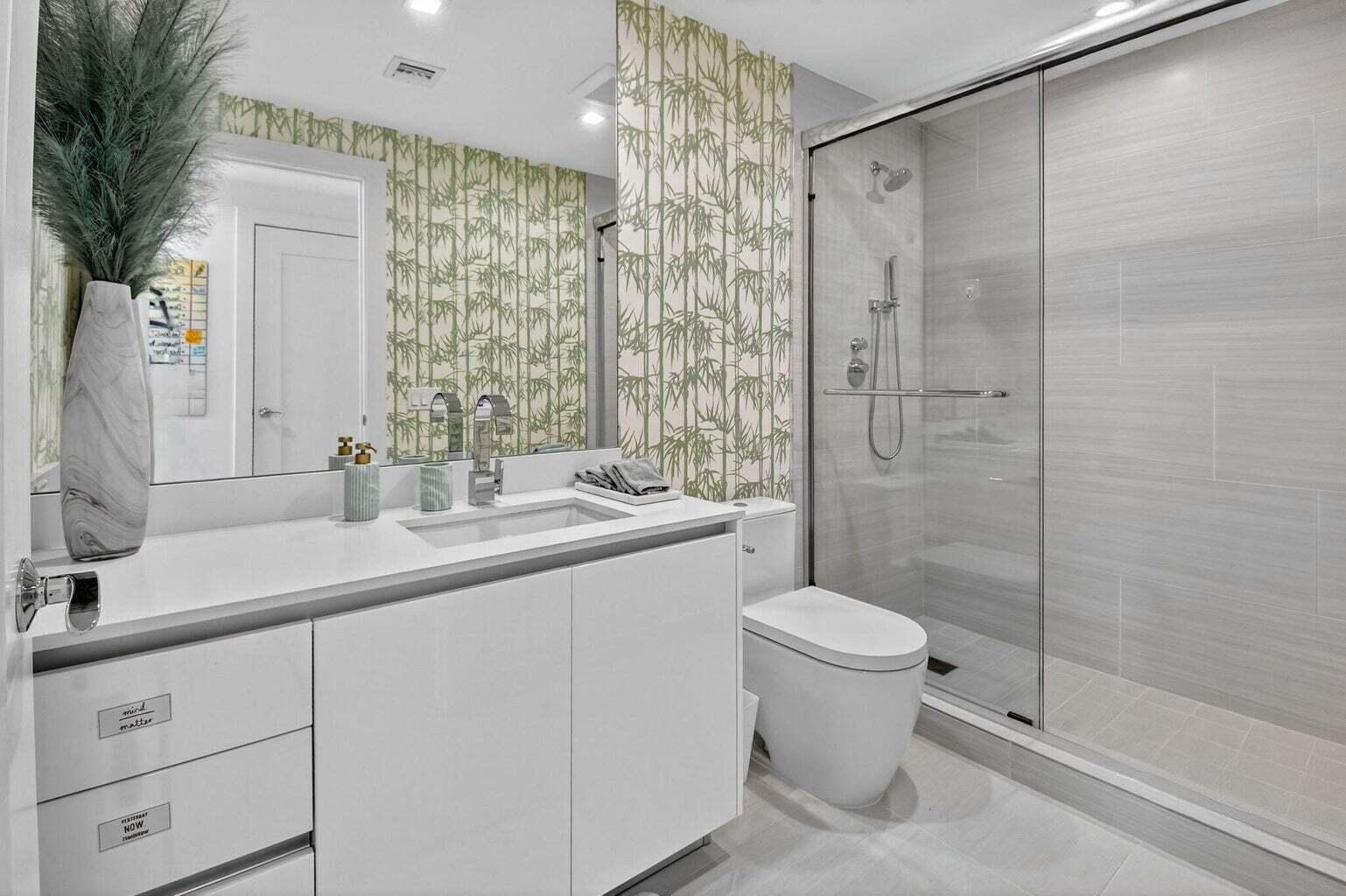 20155 Boca W Drive, Unit C504 Boca Raton, FL 33434 - Photo 12 of 42 a bathroom with a sink toilet and shower