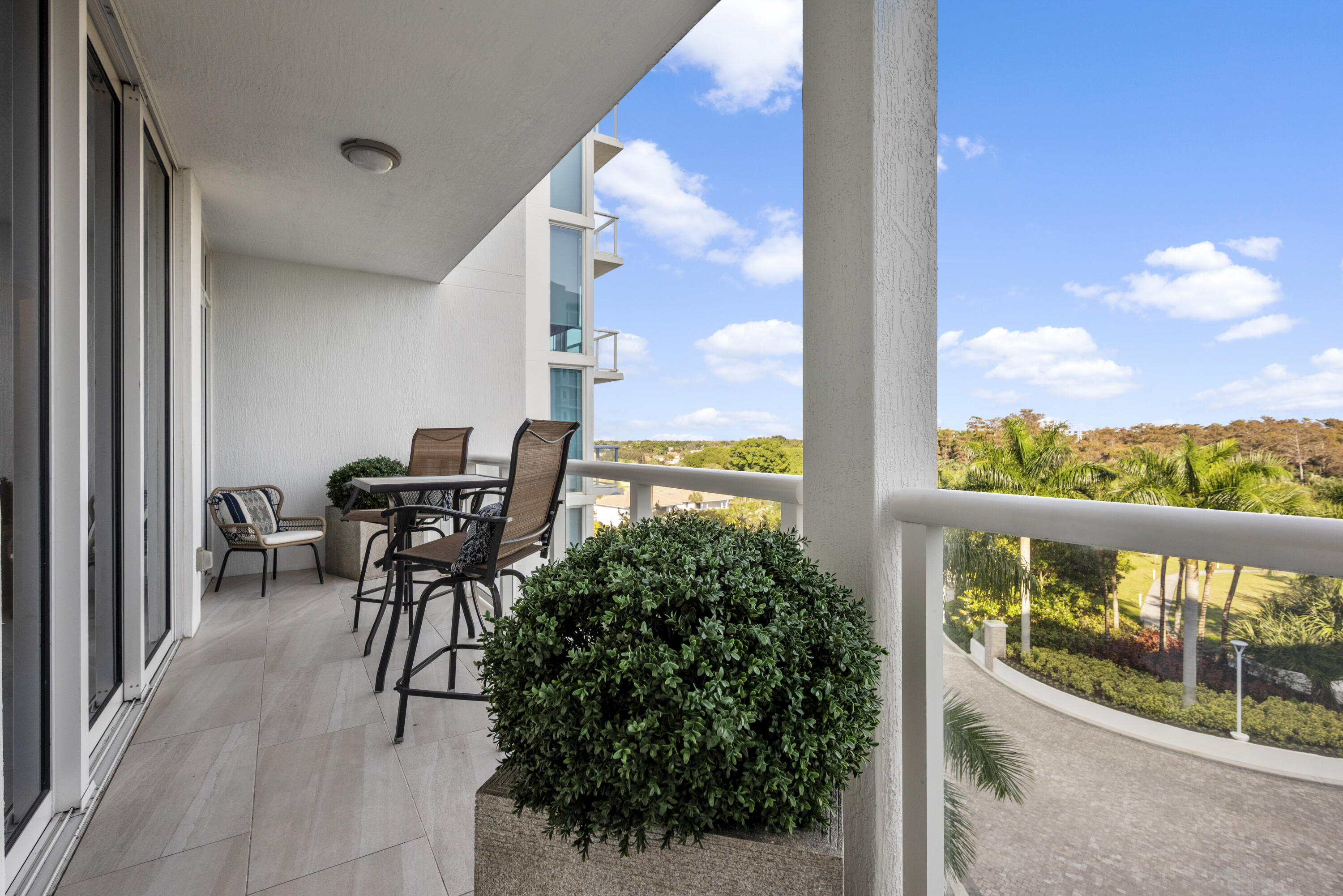 20155 Boca W Drive, Unit C504 Boca Raton, FL 33434 - Photo 27 of 42 a view of a balcony with chairs
