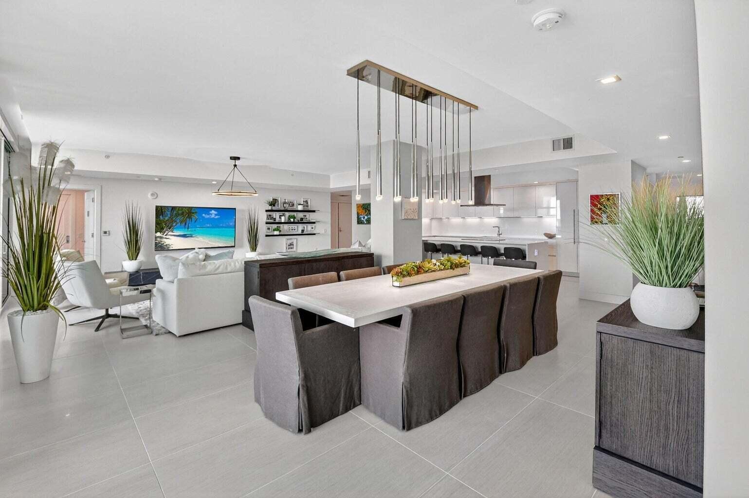 20155 Boca W Drive, Unit C504 Boca Raton, FL 33434 - Photo 4 of 42 a kitchen with stainless steel appliances kitchen island granite countertop a stove a sink dishwasher and a refrigerator