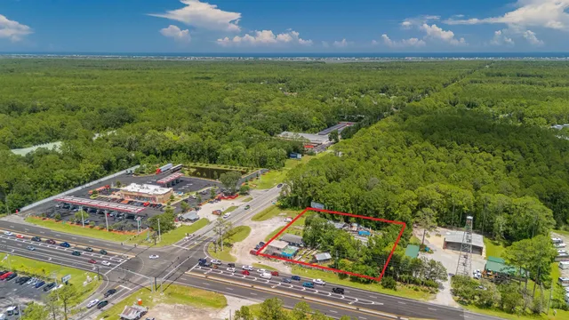 an aerial view of a house with a garden