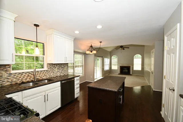 a kitchen with sink and window