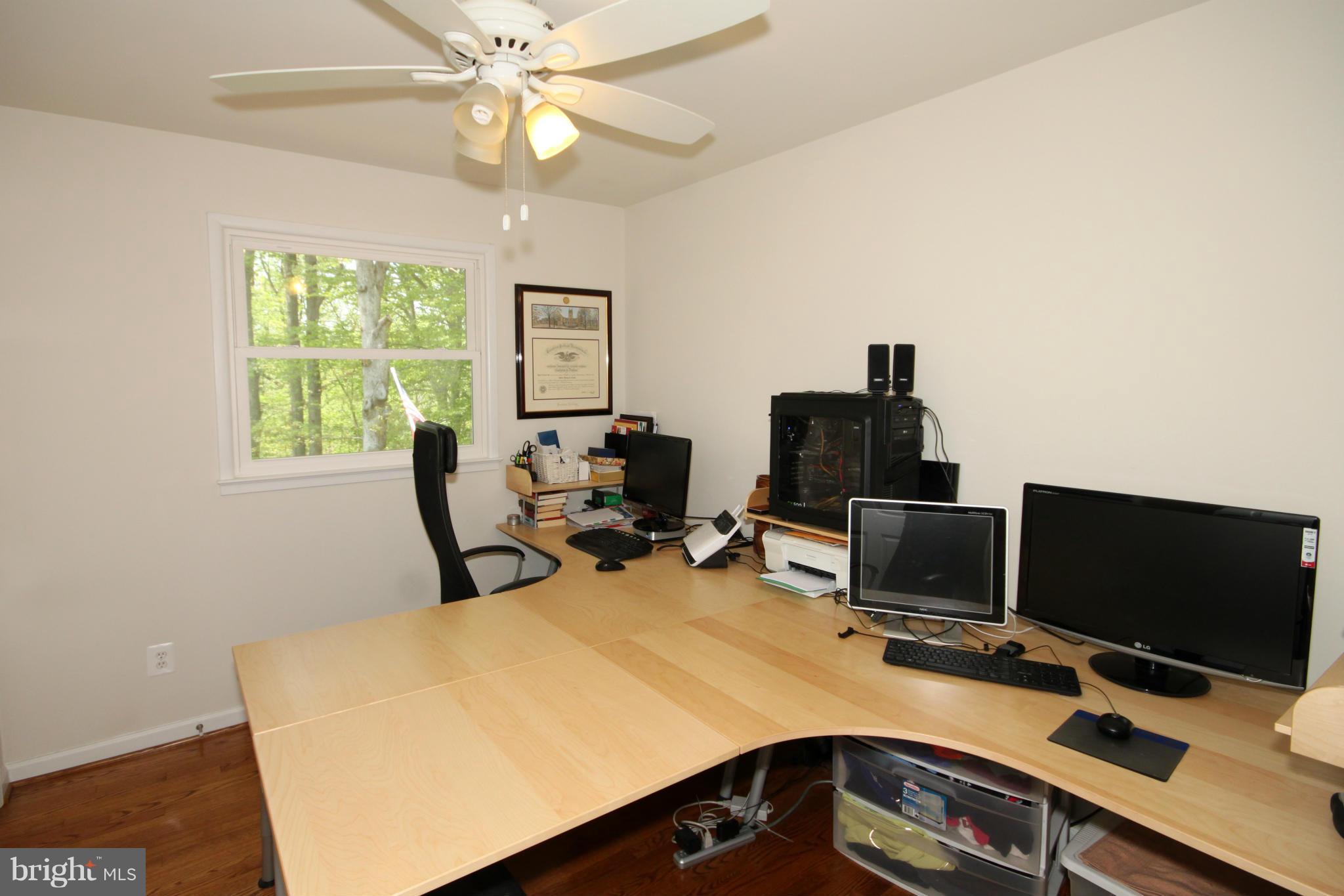 5420 Inverchapel Road Springfield, VA 22151 - Photo 18 of 29 a view of a workspace with furniture and a window