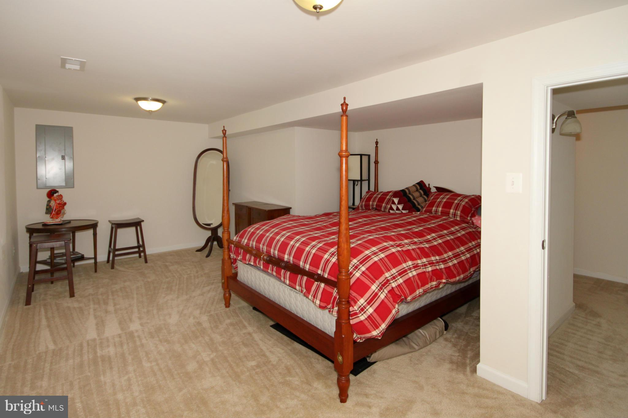 5420 Inverchapel Road Springfield, VA 22151 - Photo 19 of 29 a bedroom with a bed a table and chairs