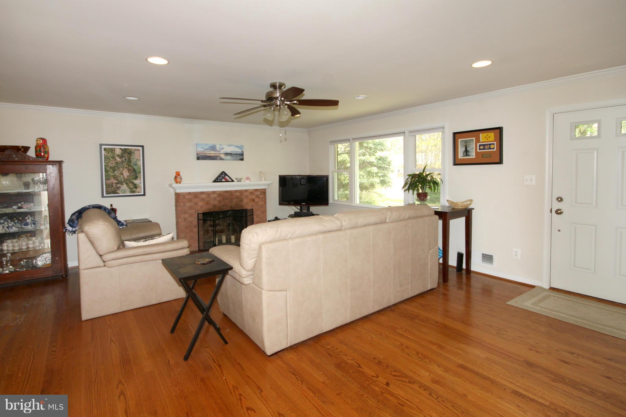 5420 Inverchapel Road Springfield, VA 22151 - Photo 3 of 29 a living room with furniture and a fireplace