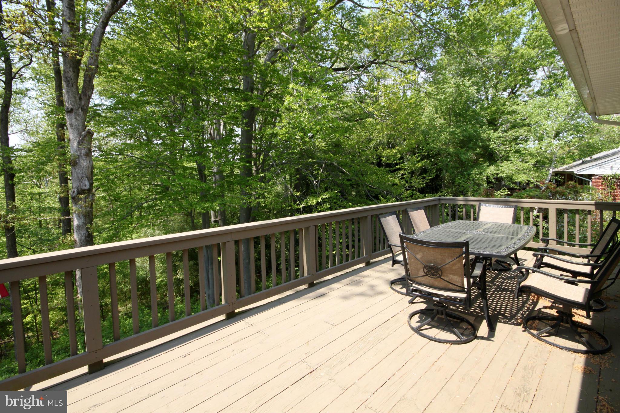 5420 Inverchapel Road Springfield, VA 22151 - Photo 24 of 29 a view of a deck with chairs and wooden fence