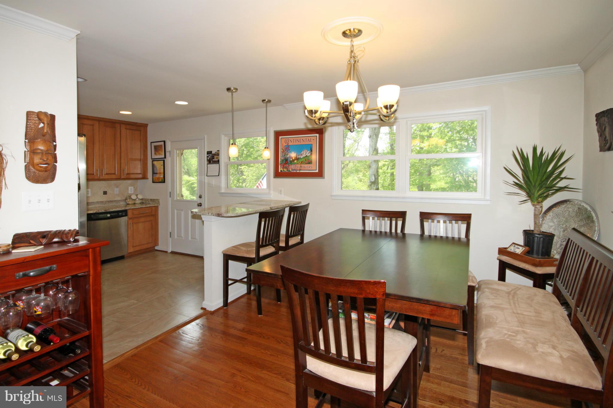 5420 Inverchapel Road Springfield, VA 22151 - Photo 7 of 29 a view of a dining room with furniture window and wooden floor
