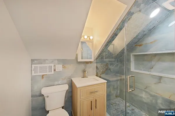 a bathroom with a toilet sink and a shower