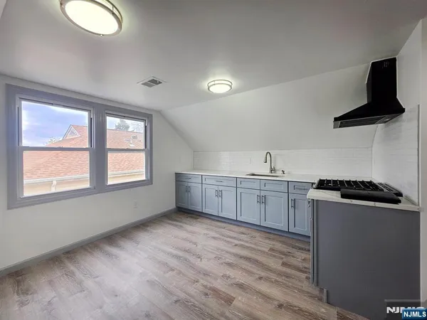 a kitchen with sink and window
