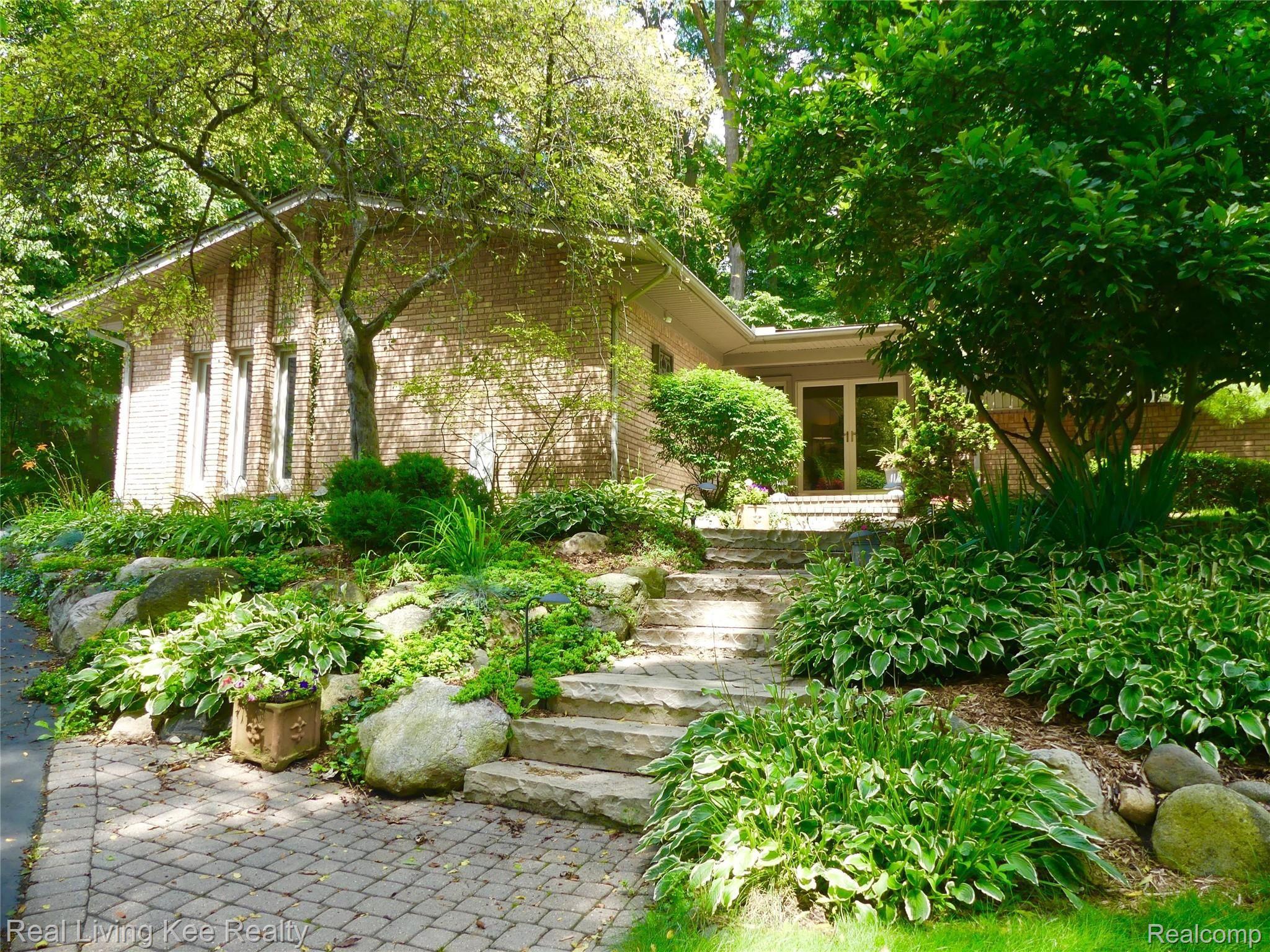Beautiful perennial gardens surround the home 