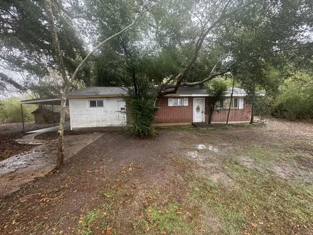 front view of a house with a trees