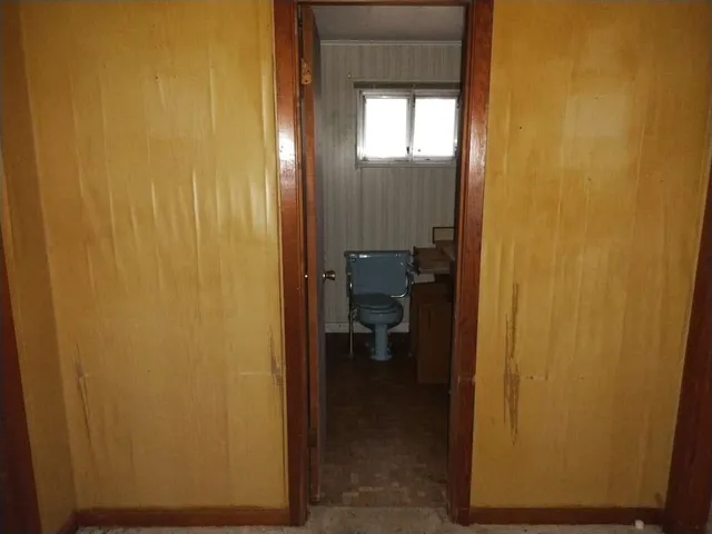 a view of a bathroom from a hallway