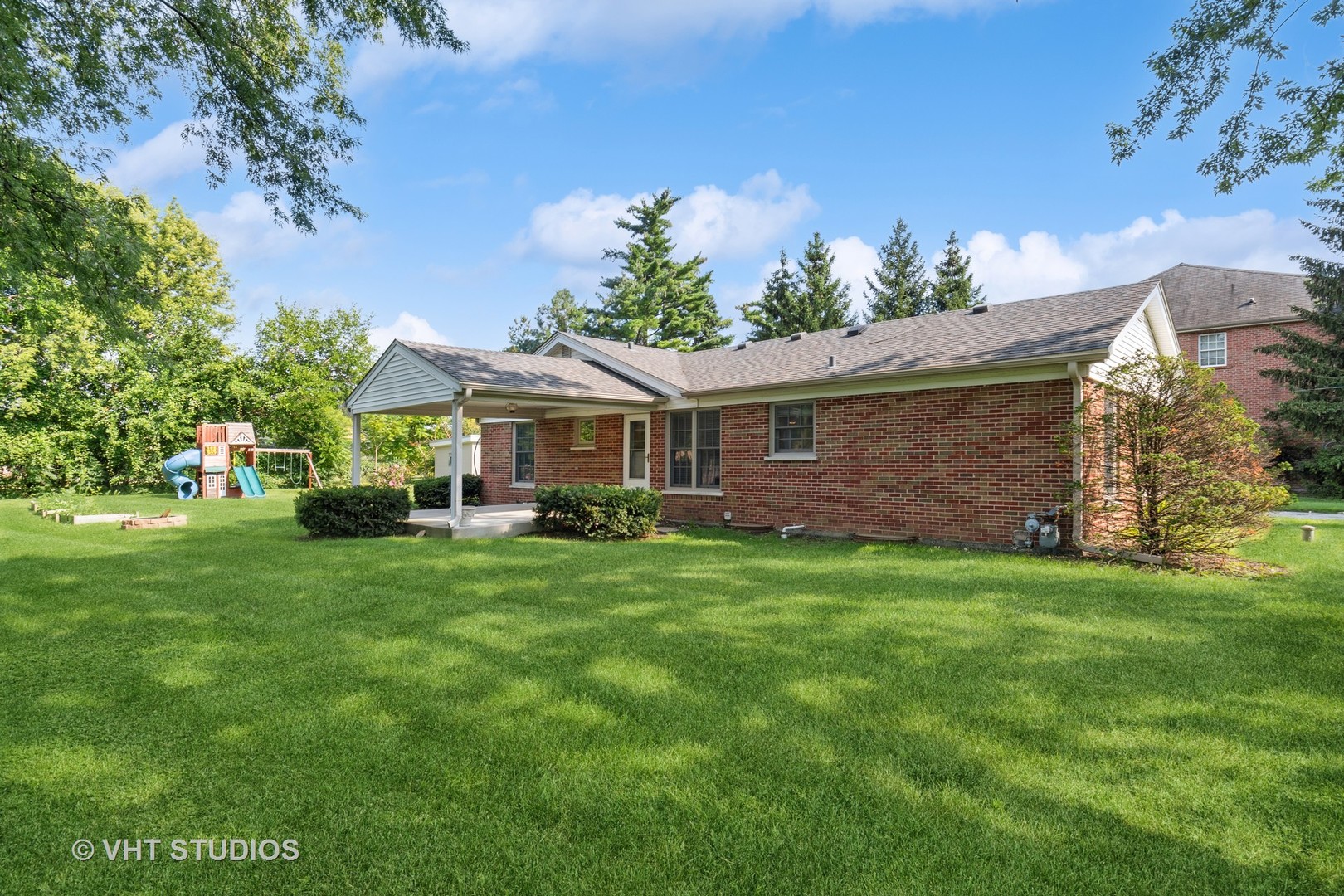 2425 Pfingsten Road Glenview, IL 60026 - Photo 16 of 22 a front view of a house with a garden
